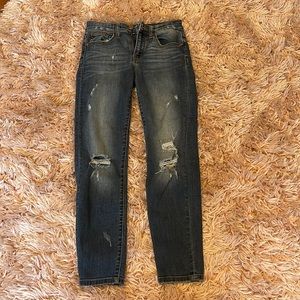 dark blue ripped jeans